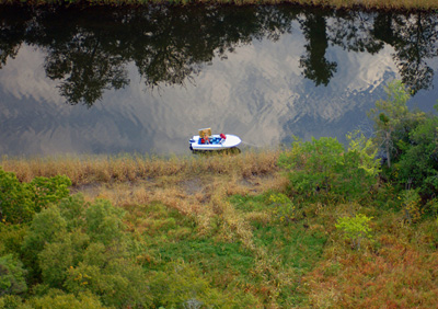  Leif painting in the boat on Selden's Creek.  Photo by Jody Dole. See the painting